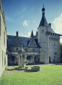 View of the Courtyard with the Main Building and a Well